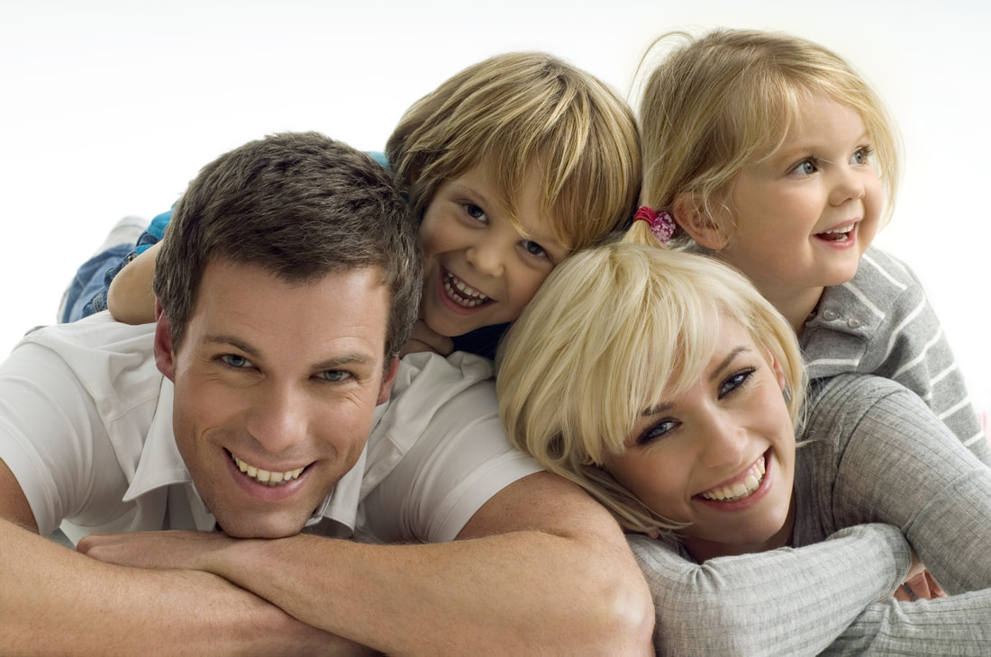 Happy family smiling after a chiropractic adjustment